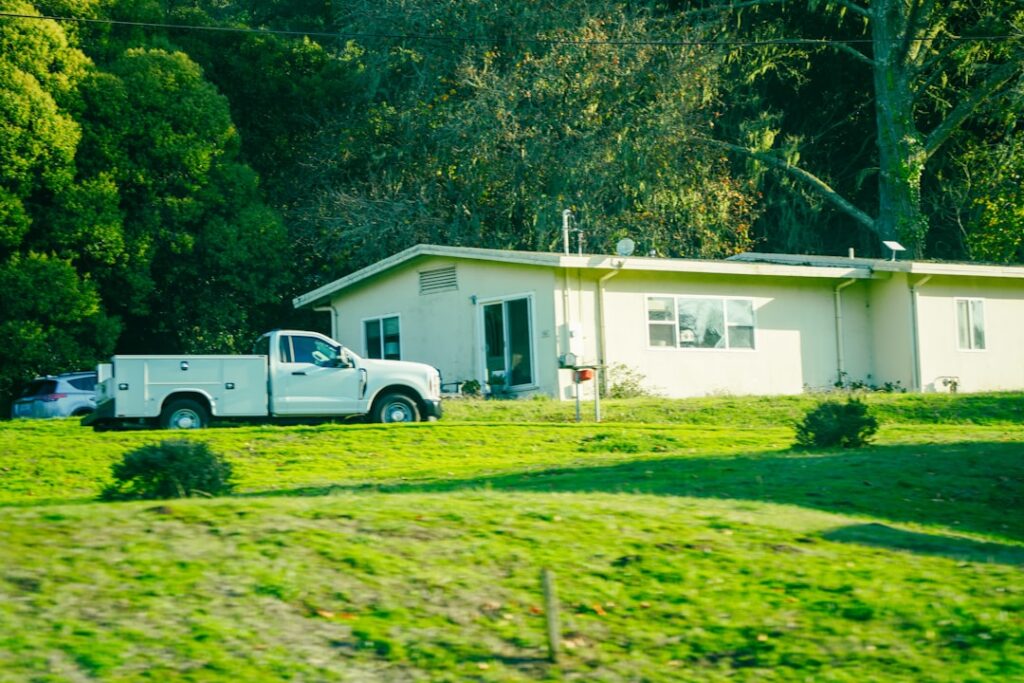 septic tank pumping truck servicing residential property