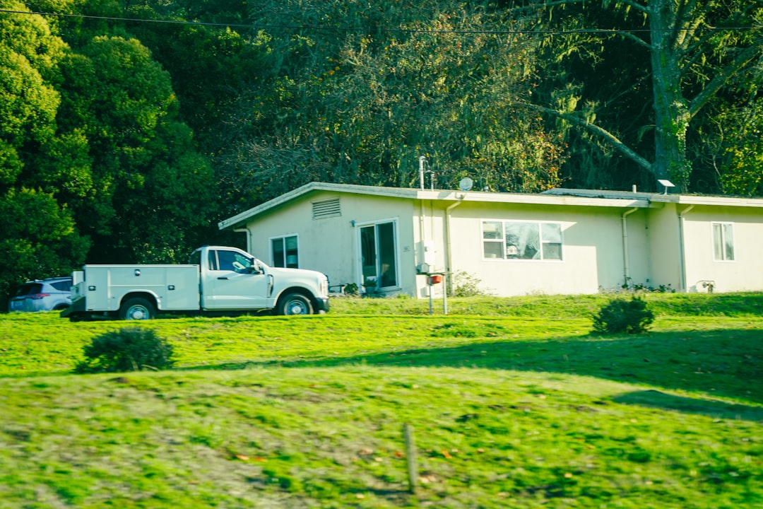 septic tank pumping truck servicing residential property